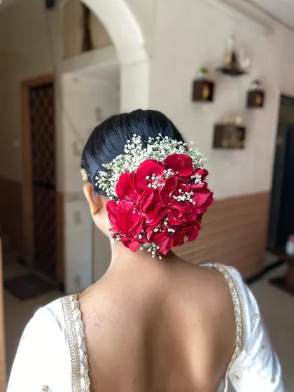Another angle of this stunning floral bun, perfect inspiration for brides who love fresh flowers.