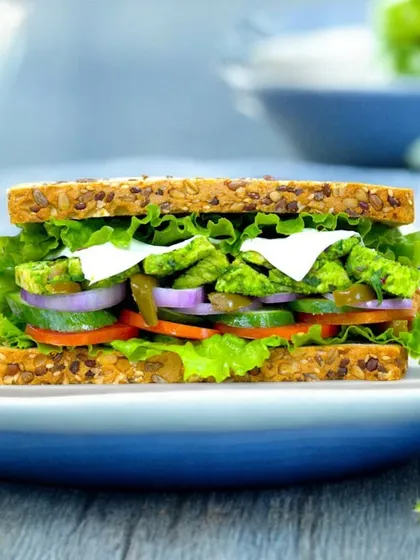 A festive twist on a classic. Our Tossed Chicken Sarson Da Saag Sandwich combines the earthy flavors of traditional saag with tender chicken, all packed into a wholesome multigrain sandwich. It’s a Lohri special you'll love.