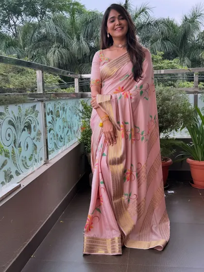 The full look, showing the graceful drape of the saree against a lovely backdrop.