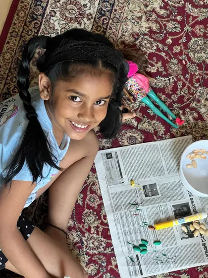 These images showcase the variety and fun of our hands-on crafting sessions, from making jewelry to creating art from recycled materials.