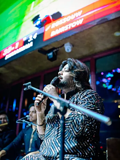 A profile shot of me singing, showcasing the passion and dedication I bring to every single note.