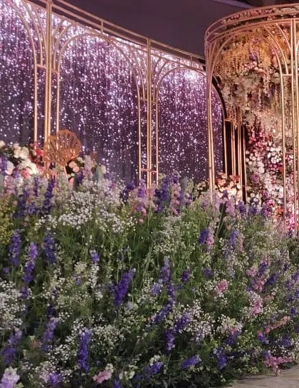 A close-up of the floral wonderland reception stage, showing the incredible texture and color variation of the flowers used to create this immersive garden.