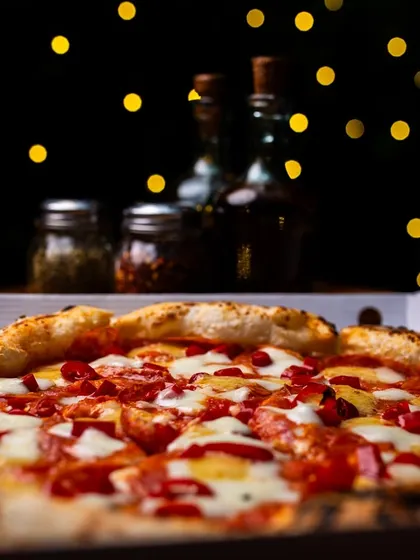 Fairy lights and pizza make everything better. Enjoy this vibe at our Amar Colony outlet or get it delivered.