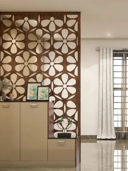A beautiful CNC-cut floral partition adds an element of artistry to this foyer. The design is paired with a simple, modern shoe cabinet, balancing intricate detail with clean lines.