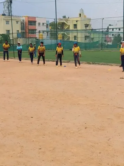 A wide shot of a fielding drill in progress. We utilize our ground space to conduct comprehensive drills that cover all aspects of fielding.