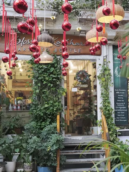 The festive season is a magical time at my salon. The entrance is adorned with beautiful decorations and greenery, creating a warm and welcoming holiday ambiance.