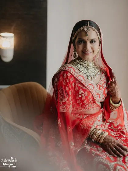 A smiling portrait of the bride, Krutika, looking directly at the camera, her warmth and happiness shining through.