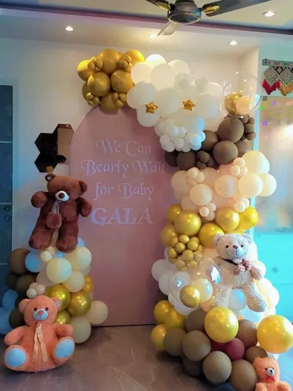 Welcome the little one with our adorable "We Can Bearly Wait" baby shower theme. This setup combines a custom pink backdrop with an organic balloon arch in pastel, brown, and gold tones, complete with cute teddy bear props for a heartwarming celebration.