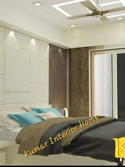 A modern bedroom with a minimalist aesthetic. The headboard wall features a combination of white geometric panels and a dark textured accent, complemented by subtle lighting.
