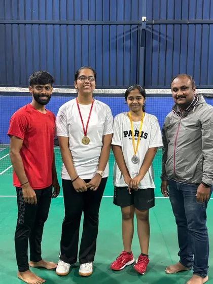 Two more of our skilled trainees with their medals, standing with the coaches who guide them. This highlights the strong bond between our players and mentors.