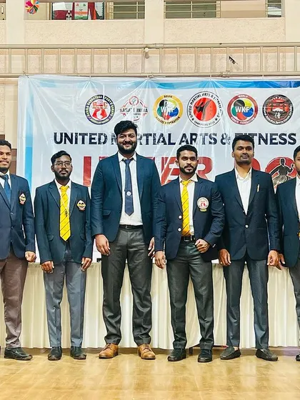 Our team of coaches standing proud at the UMC Karate Championship.
