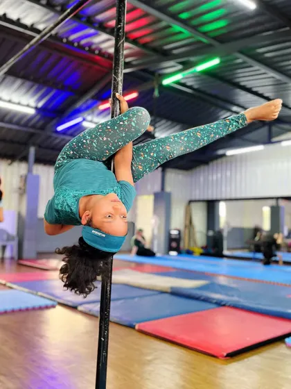 Unleash your inner acrobat. We help you defy gravity and find freedom in motion with poses like this inverted split, perfect for building strength and confidence.