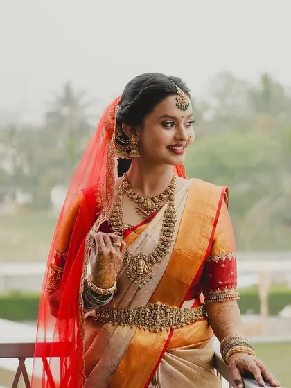 A beautiful outdoor shot of Brunda, capturing the grace and elegance of her muhurtham attire.