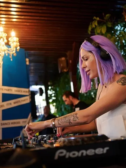 Mixing tracks at the beautiful outdoor venue. We can play in any setting, from dark clubs to elegant garden parties.