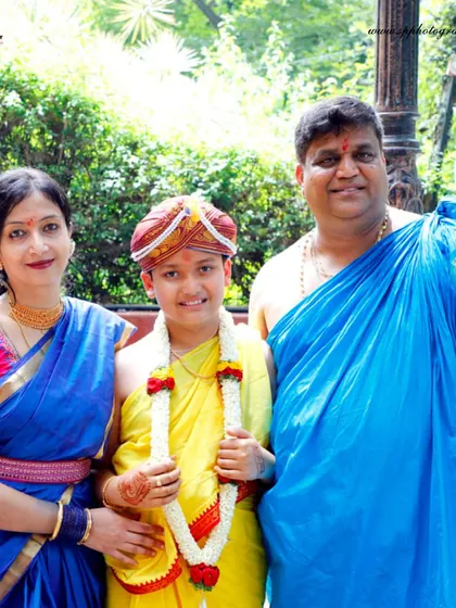 A proud family stands together for a portrait during their son's Upanayanam ceremony. We ensure we capture these important group photos for you to remember the day.