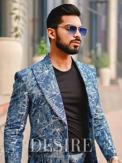 A powerful portrait in the blue splatter-print blazer. Paired with a simple black tee, the blazer becomes the undeniable centerpiece of the outfit.
