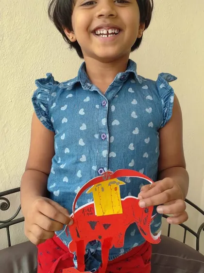 Children proudly display their artwork for Dusshera. Creating these festive crafts helps them connect with cultural traditions while practicing important skills like cutting, pasting, and designing.