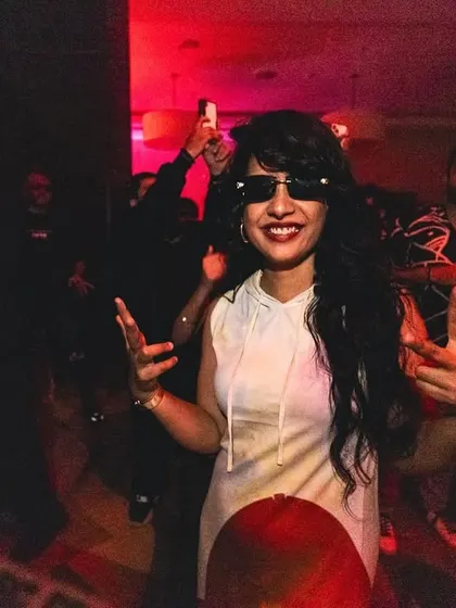 A guest enjoying the music, fully immersed in the party atmosphere. Our events are about creating moments of pure joy and freedom for everyone who attends.
