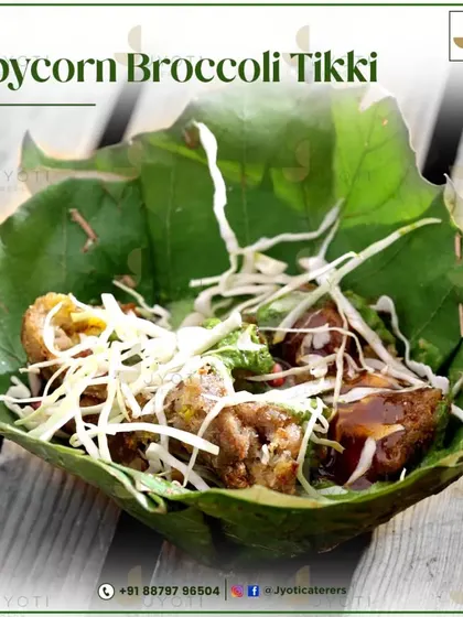 A healthy and delicious Babycorn Broccoli Tikki. Served in a natural leaf bowl and topped with fresh slaw, it's a guilt-free indulgence packed with flavour.