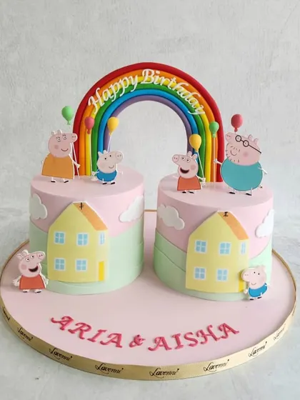 A double birthday celebration with these adorable Peppa Pig cakes. We created a shared scene with two cakes, featuring the whole Peppa Pig family enjoying a day out.
