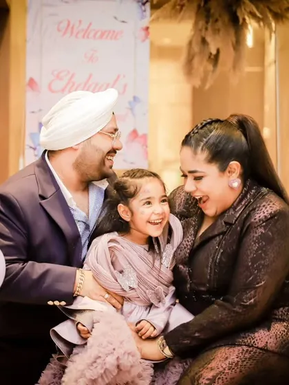 A duplicate of image 101, capturing the family's infectious laughter and joy.