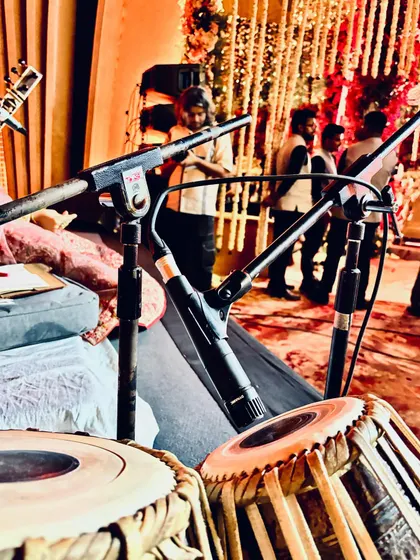 A close-up of my tabla and microphone setup before a show. Professional sound is key to a great performance, and we take it very seriously.