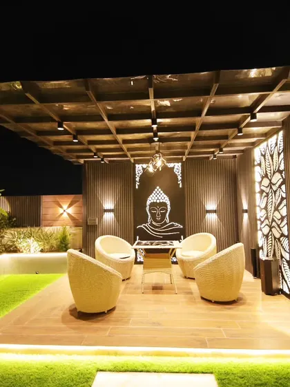 A wider angle of the pergola lounge in Sushant Lok, showing its relationship to the rest of the open terrace.