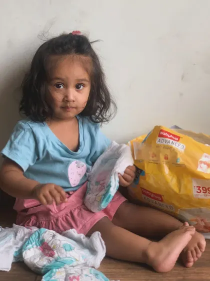 A candid moment during a diaper change. Using quality diapers like Babyhug Advanced makes these daily routines much smoother.