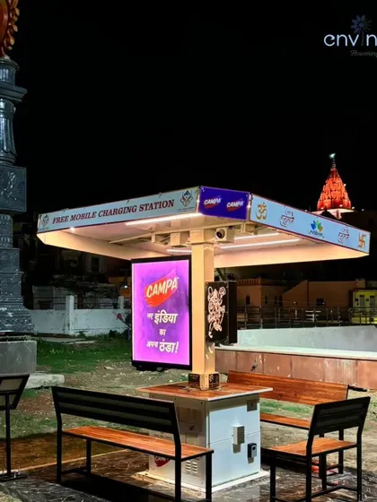 The strategic placement of our solar hut at Siddhi Park, with the spire of a nearby temple visible in the background. This composition highlights how your brand can be present in areas of deep cultural and spiritual importance.