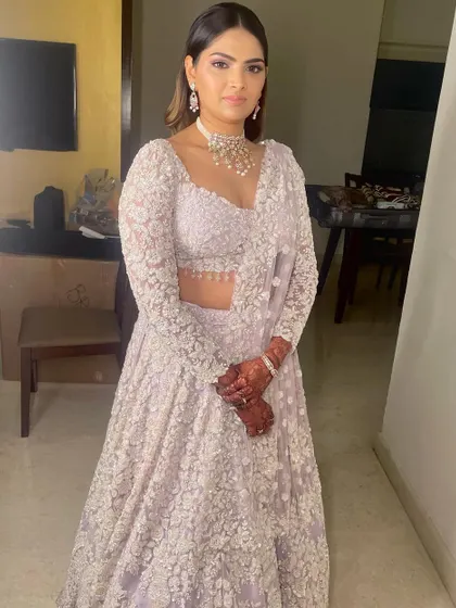 The full view of this intricate lilac lehenga, paired with elegant makeup for a memorable Sangeet night.