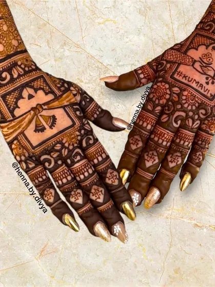 This bridal back-hand design is rich with personal and cultural details. It includes a doli (palanquin) motif and the word "Kumavi" to honor the bride's heritage.