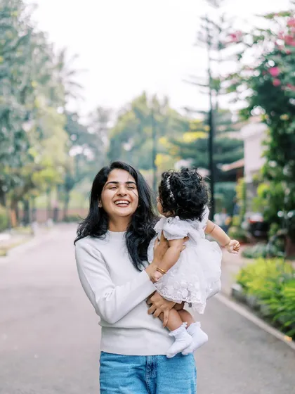 A mother and daughter sharing a happy moment on a quiet street. Even urban settings can be great for lifestyle photos.