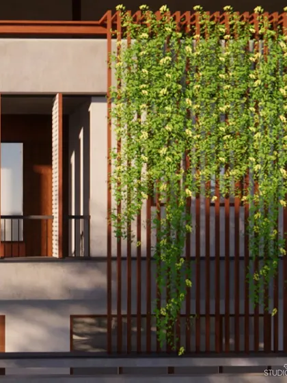 A vertical trellis with flowering creepers acts as a natural curtain for this facade. This biophilic element not only adds beauty and shade but also contributes to the building's climate-responsive design by cooling the exterior wall.