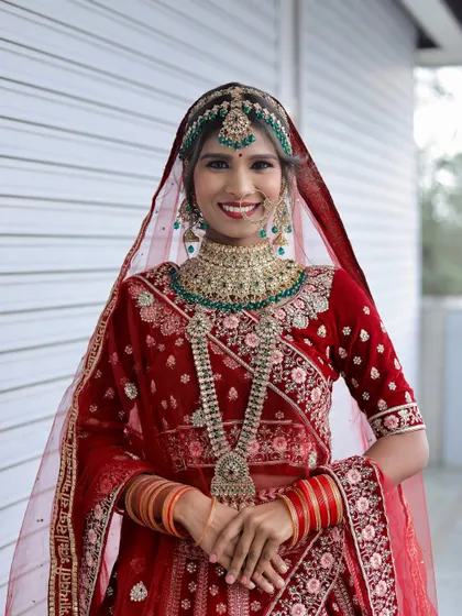 The joy on a bride's face is the best reward. This is another beautiful creation by a student, showcasing a complete and polished bridal look.