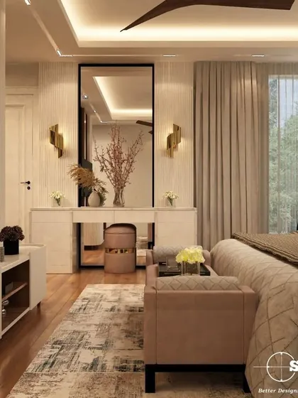 A master bedroom designed as a tranquil sanctuary. This space features a neutral color palette, a custom upholstered bed, and a sleek dressing unit with integrated lighting. The focus is on creating a calm, uncluttered environment that promotes rest and relaxation.