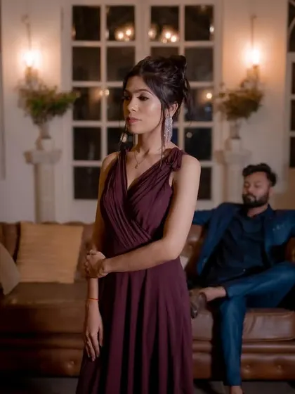 A sophisticated and moody pre-wedding shot. The makeup is elegant and refined, with a focus on her eyes.