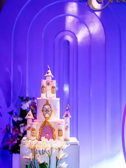 A fairytale dream come true with this beautiful castle themed cake. This multi-tiered cake is perfect for a little girl's princess-themed party.