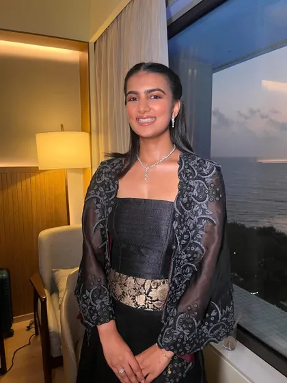 The subtle makeup allows her natural beauty to be the star, perfect for an elegant evening event.