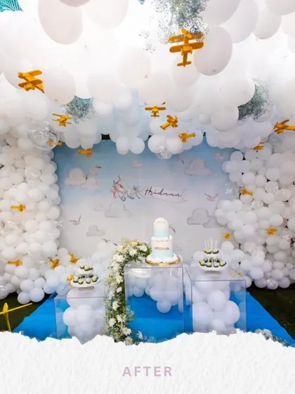 The dream was a sky full of clouds and airplanes for Hridaan's birthday. This stunning backdrop, with fluffy white balloon clouds and tiny wooden planes, made his aviation-themed party take flight.