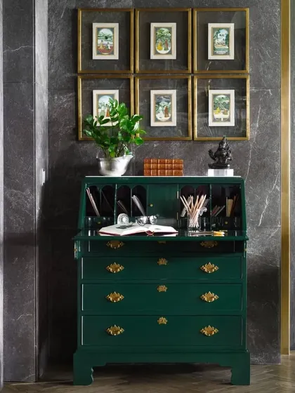 A vintage 'Queen of Vintage' Secrétaire gets a vibrant makeover with a mosque green lacquer finish. Adorned with a collection of old ivory Indian miniature paintings, it's a perfect example of how we love to breathe new life into classic pieces.