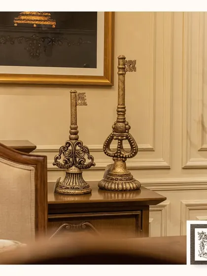 Unlock timeless elegance with these regal, antique-style key sculptures. They are perfect for adding a touch of vintage charm and curiosity to a side table or shelf.