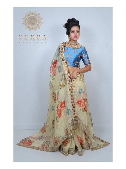 The full ensemble with the dupatta, showcasing how the blue blouse provides a beautiful pop of color against the light, airy floral lehenga.