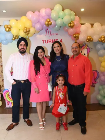 The whole family posing for a picture in front of the pastel balloon backdrop. I create these photo zones to help you capture the memories of your special day.