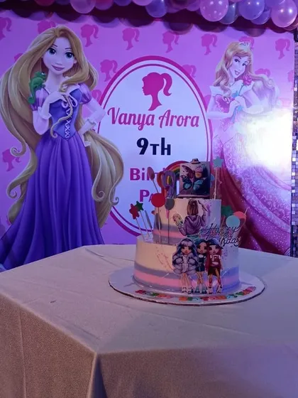 The centerpiece of the party, a custom three-tiered Barbie cake, perfectly matching the theme and ready for the birthday girl's celebration.