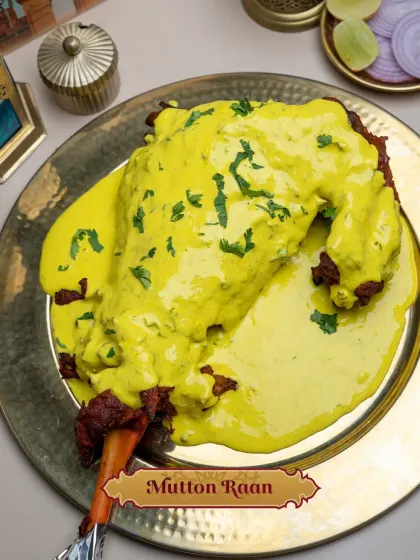 My Mutton Raan, presented in a pool of golden Peshawari sauce. The tandoori-cooked leg of mutton is generously covered in this creamy, aromatic gravy, making it a perfect centerpiece for a special occasion like an Iftar feast.