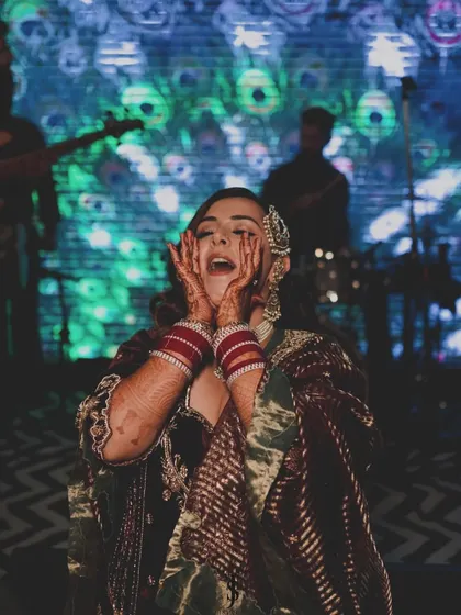 A moment of pure joy and excitement from the bride at her reception party.