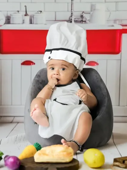 Our little master chef is taking a break. The miniature kitchen setup is filled with fun details and props for an interactive photoshoot.
