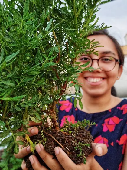 A happy moment while repotting. There's something so calming about holding a plant and feeling its roots in your hands.
