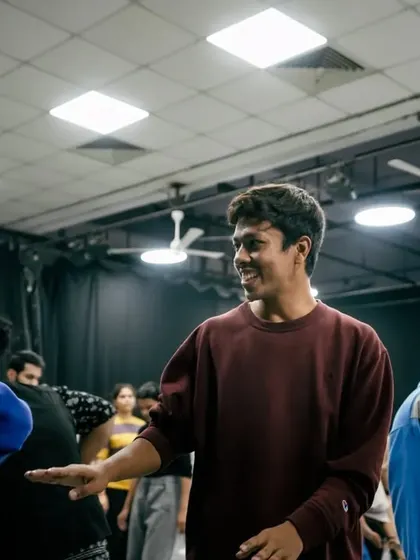 A candid moment of laughter and connection between students during a break.