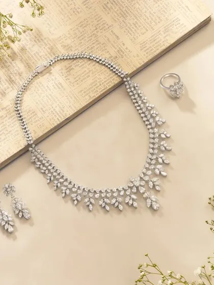 Another elegant composition for Nanagram Jewels. This flatlay uses baby's breath flowers and an old book page to create a delicate, romantic, and vintage-inspired setting for the diamond necklace set.